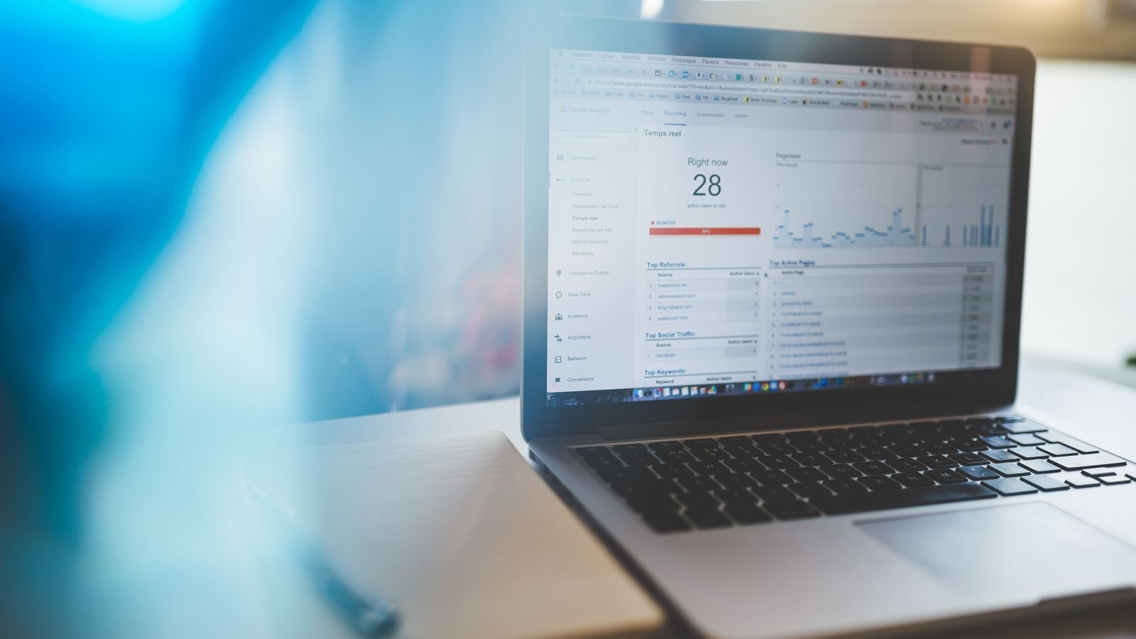 A laptop showing website analytics, the first place to check after a Google spam update